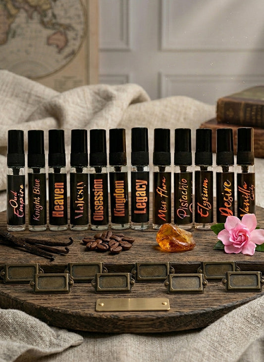 Set of small bottles with labels on a wooden tray, surrounded by decorative items.