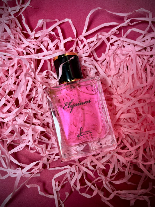 Perfume bottle labeled 'Elysiun' on pink shredded paper
