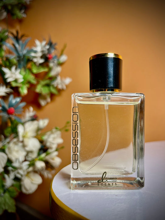 Perfume bottle labeled 'Obsession' by 'elexis' with a floral background