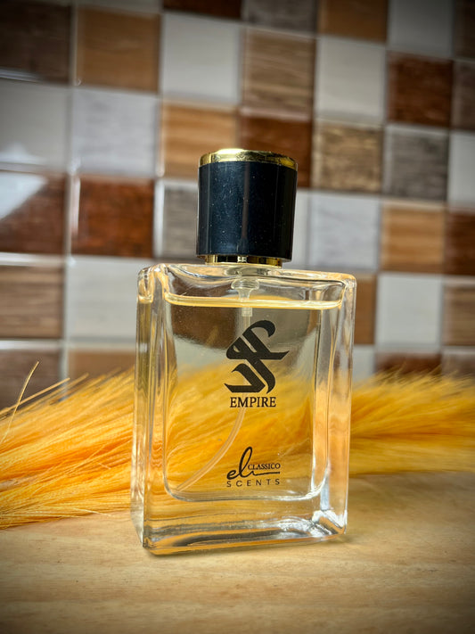 Perfume bottle labeled 'Empire' on a wooden surface with a tiled wall background