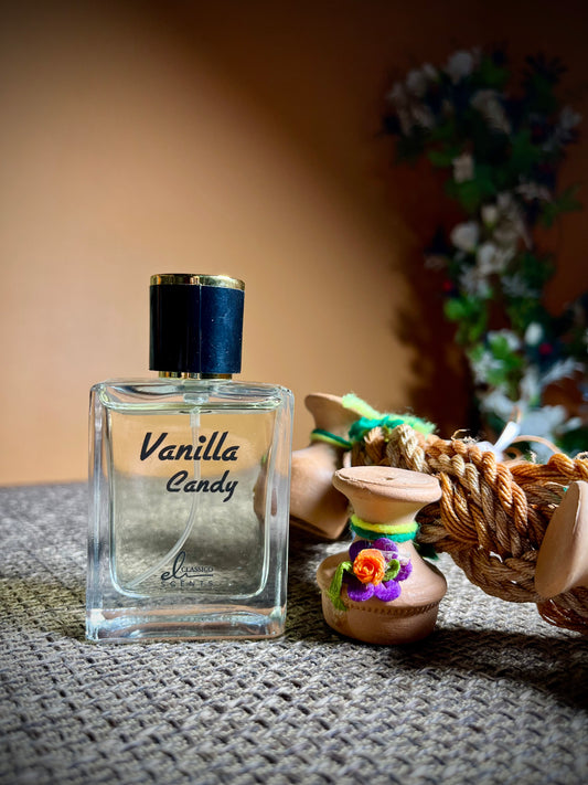 Vanilla Candy perfume bottle on a textured surface with decorative items in the background